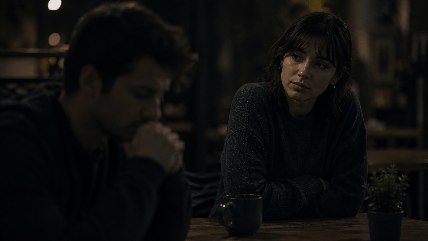 why do i take everything personally – a person watching someone across a table with concern and self-consciousness, searching for meaning in a quiet interaction